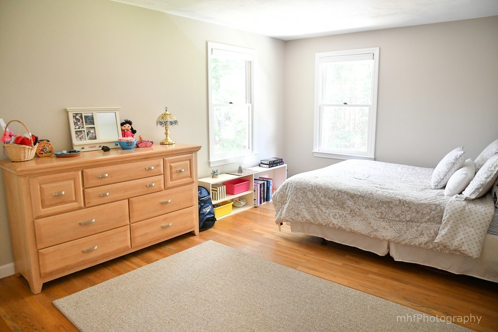 82 Cranberry Circle Sudbury, MA 01776 - Photo 19 of 30 a bedroom with a bed and a window
