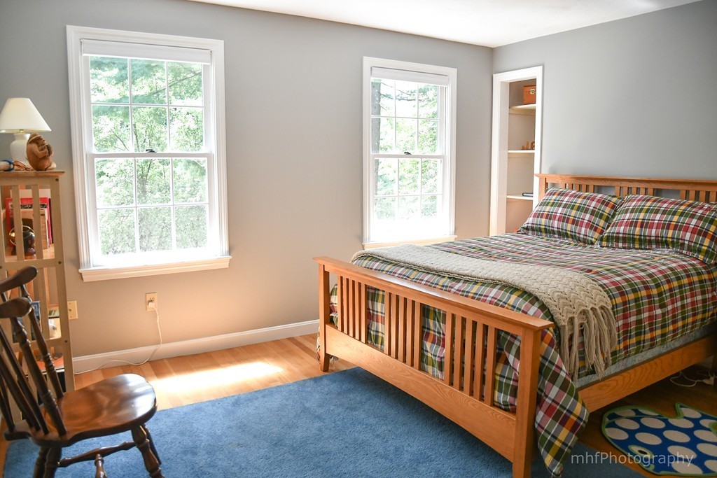 82 Cranberry Circle Sudbury, MA 01776 - Photo 20 of 30 a bedroom with a bed and a window