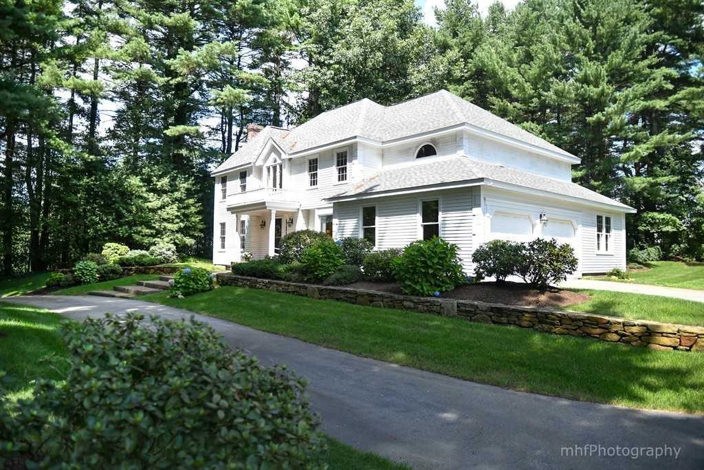 82 Cranberry Circle Sudbury, MA 01776 - Photo 2 of 30 a front view of a house with a yard
