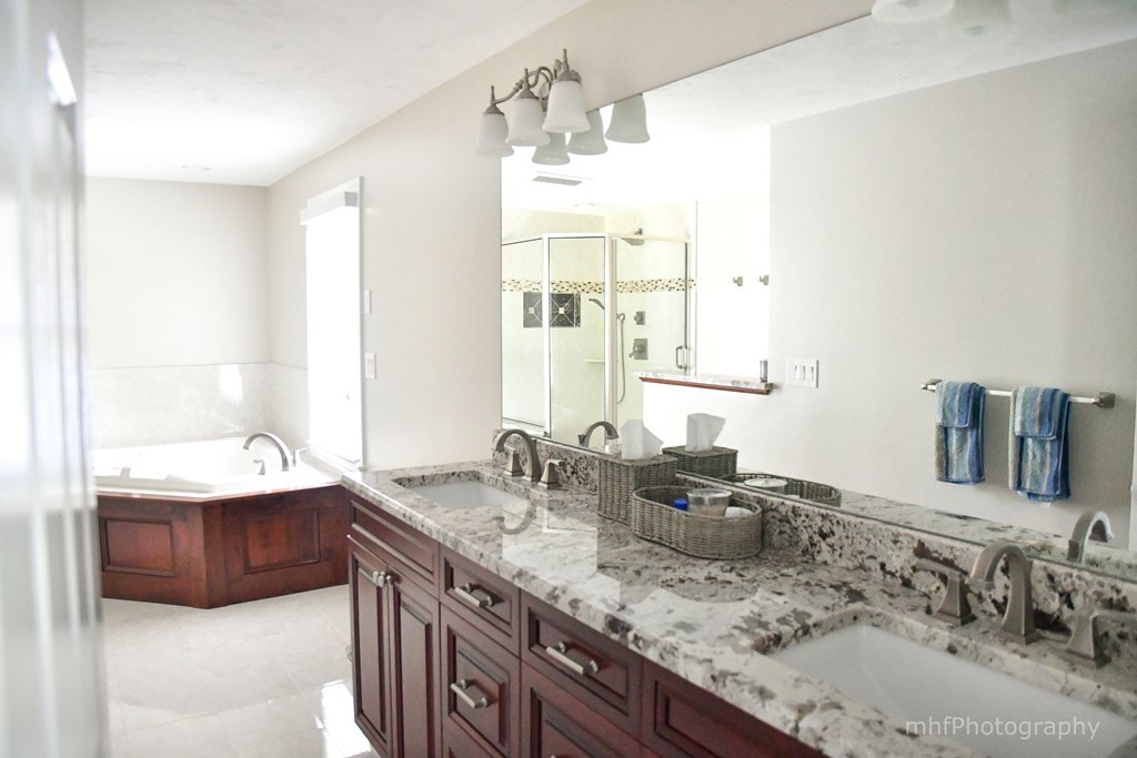 82 Cranberry Circle Sudbury, MA 01776 - Photo 24 of 30 a bathroom with a granite countertop double vanity sink and a mirror