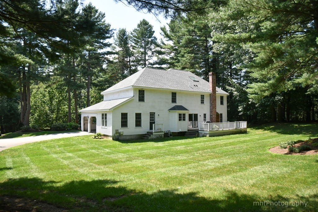 82 Cranberry Circle Sudbury, MA 01776 - Photo 28 of 30 a front view of a house with yard and green space