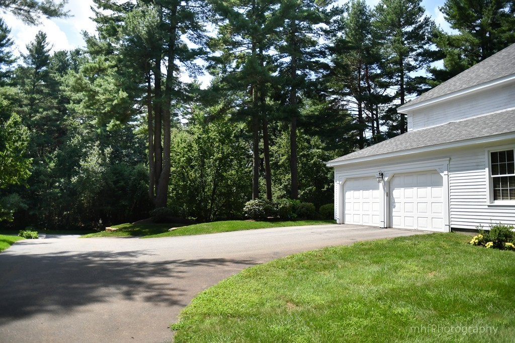 82 Cranberry Circle Sudbury, MA 01776 - Photo 30 of 30 a house that has a tree in front of it