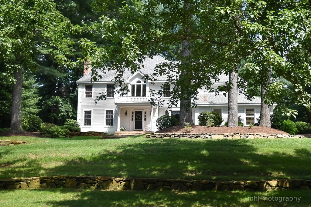 82 Cranberry Circle Sudbury, MA 01776 - Photo 3 of 30 a front view of a house with a garden