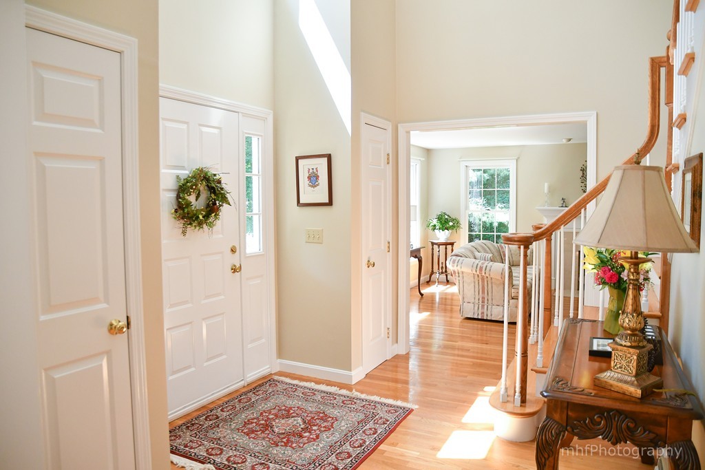 82 Cranberry Circle Sudbury, MA 01776 - Photo 6 of 30 a view of an entryway with wooden floor and windows
