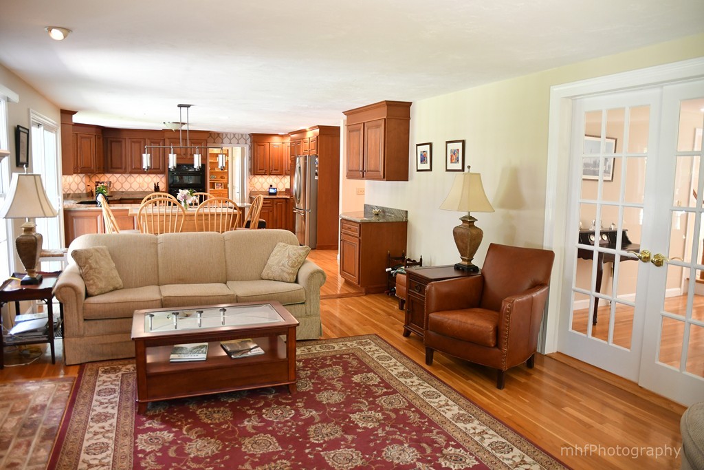 82 Cranberry Circle Sudbury, MA 01776 - Photo 10 of 30 a living room with furniture wooden floor and a table
