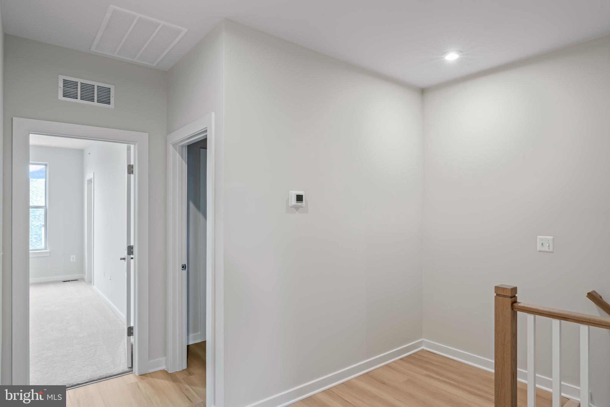 2152 Glacier Road, Unit 66 Herndon, VA 20170 - Photo 22 of 50 a view of a hallway with wooden floor