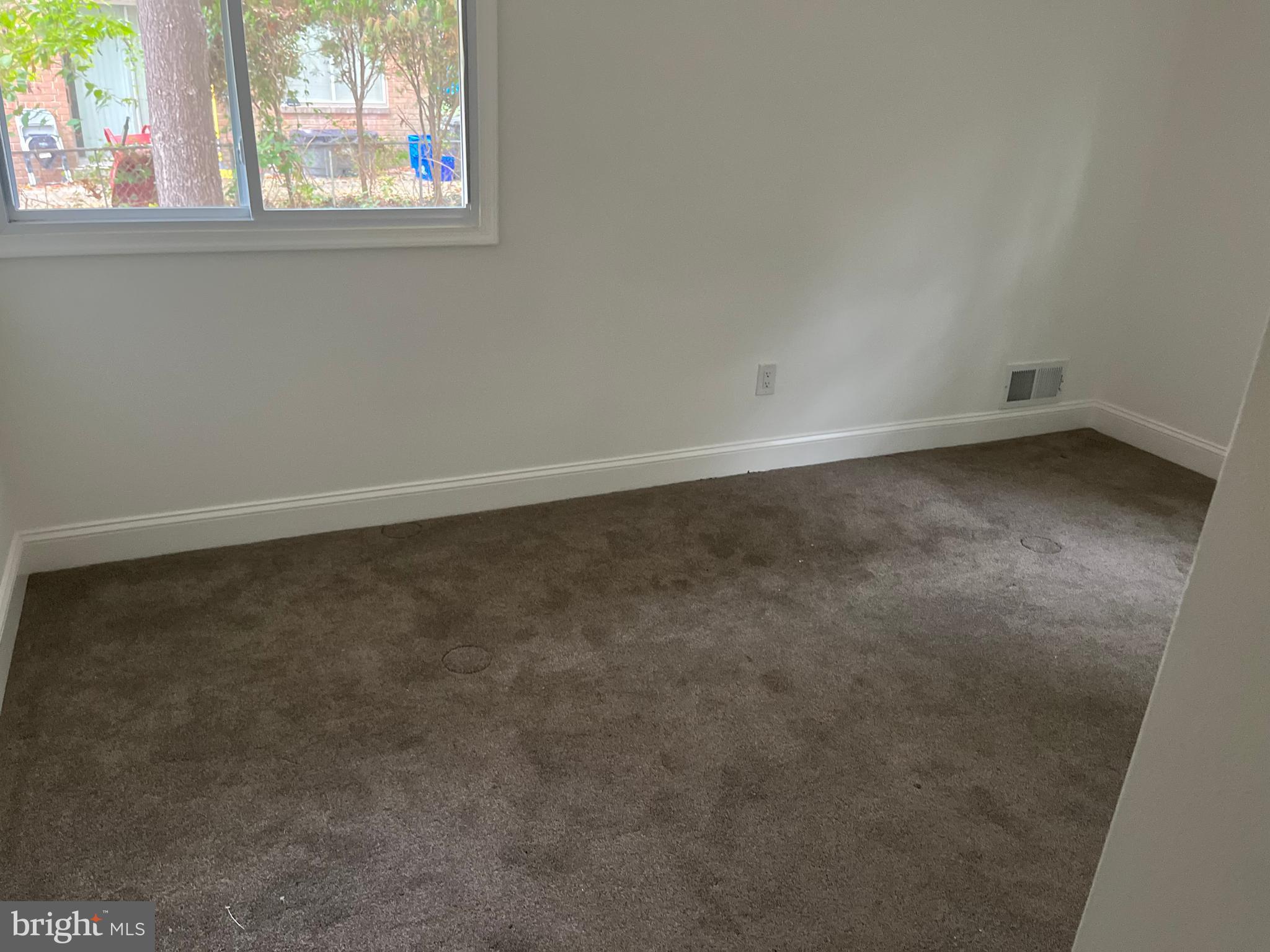 611 Winona Court Silver Spring, MD 20902 - Photo 7 of 15 an empty room with a window