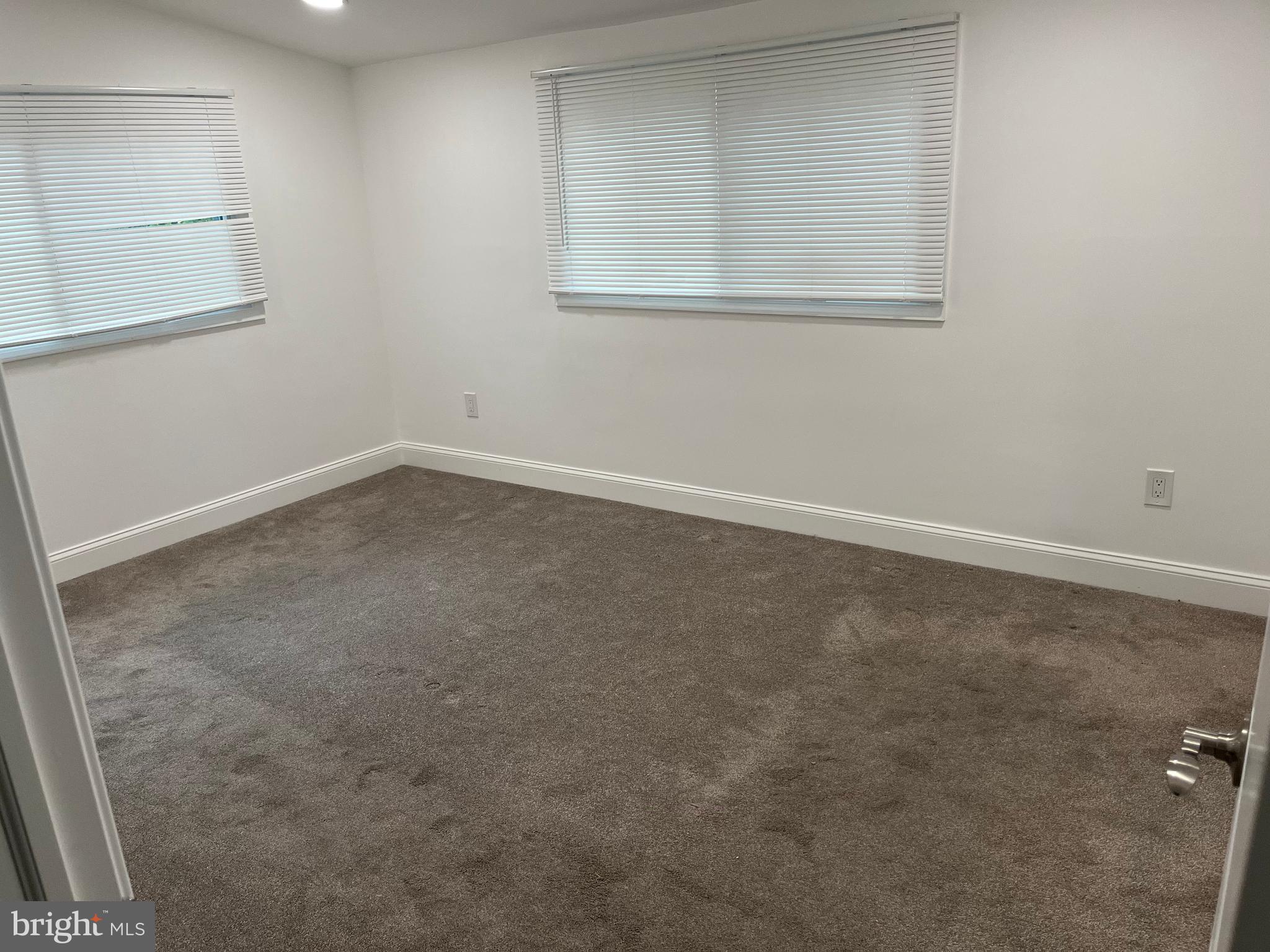 611 Winona Court Silver Spring, MD 20902 - Photo 9 of 15 an empty room with a window