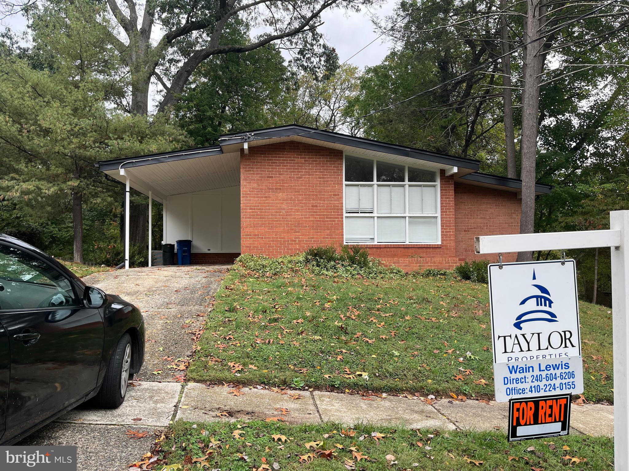611 Winona Court Silver Spring, MD 20902 - Photo 10 of 15 a front view of a house with garden