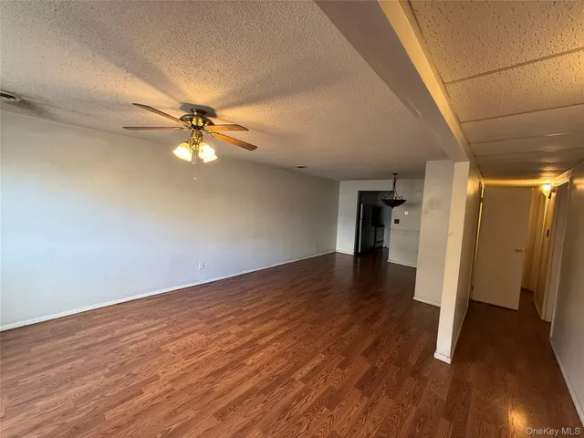 a view of a livingroom with wooden floor