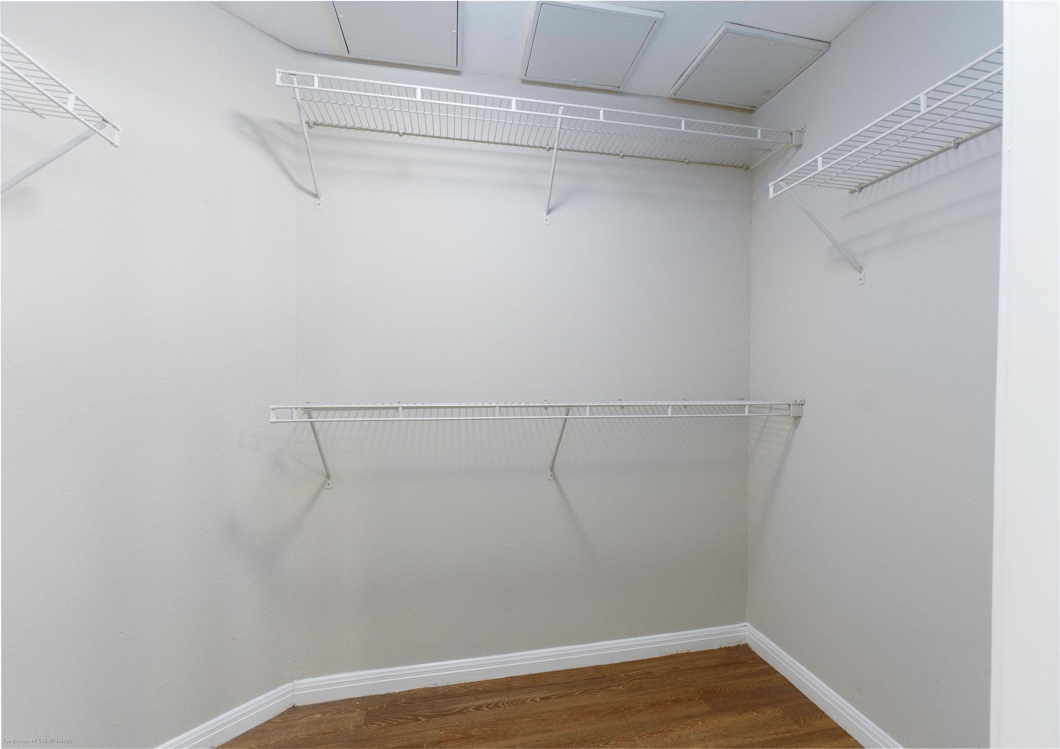 2502 Leon Street, Unit 305 Austin, TX 78705 - Photo 21 of 26 Spacious closet featuring wood finished floors