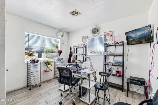 a view of a livingroom with furniture and a window