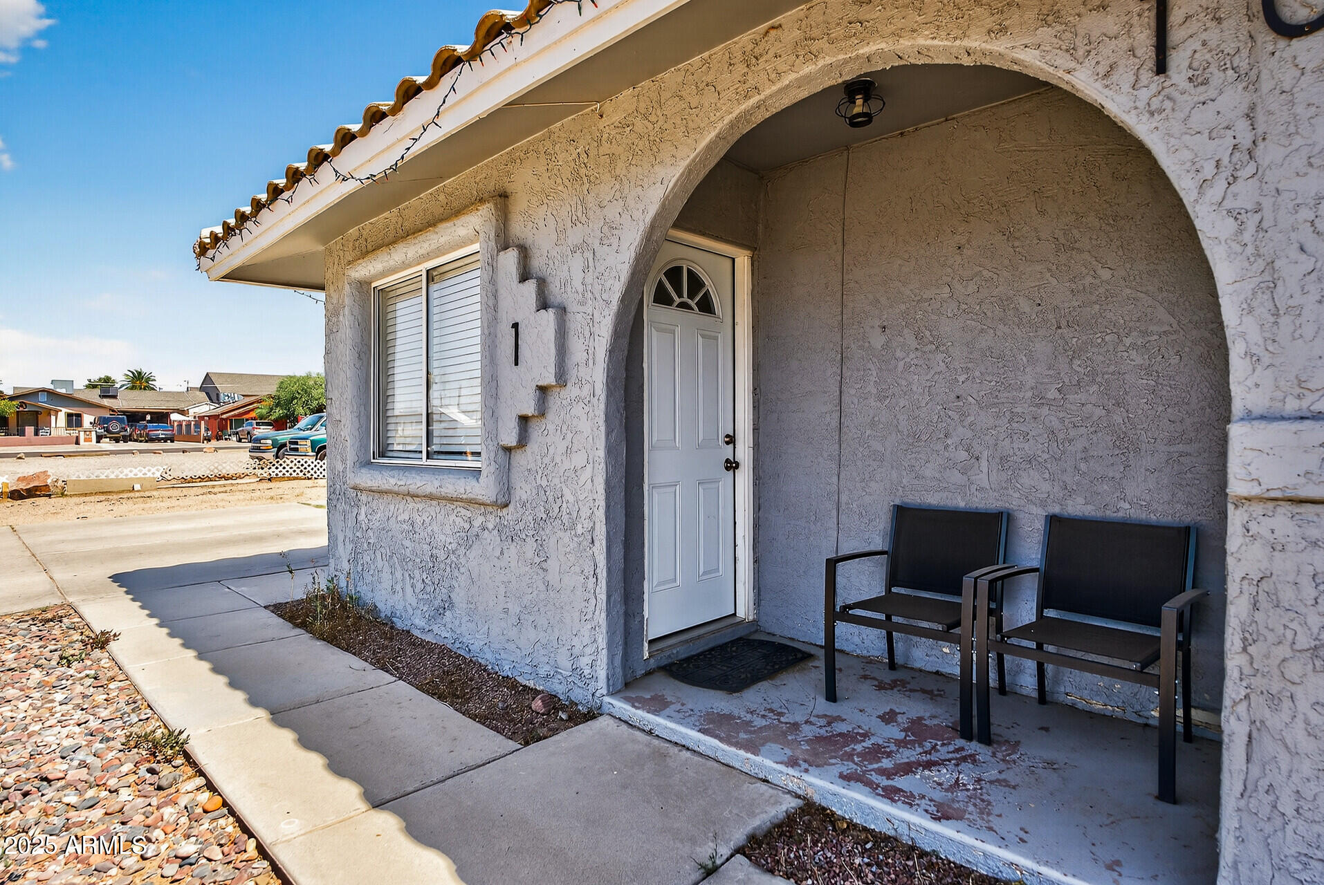 107 West 11th Street Casa Grande, AZ 85122 - Photo 5 of 45 a front view of a house with outdoor seating