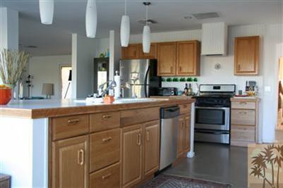 68470 Terrace Road Cathedral City, CA 92234 - Photo 11 of 17 a kitchen with stainless steel appliances granite countertop a stove and a sink