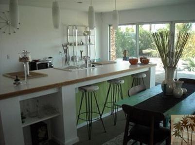 68470 Terrace Road Cathedral City, CA 92234 - Photo 12 of 17 a kitchen with a table chairs and a sink