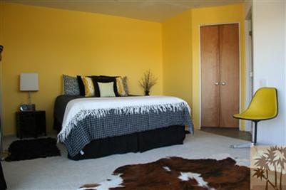 68470 Terrace Road Cathedral City, CA 92234 - Photo 8 of 17 a bedroom with a bed and a lamp on table