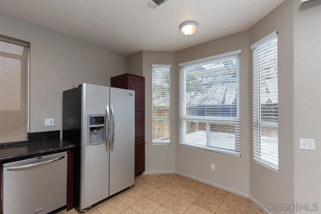 555 Kiley Road Chula Vista, CA 91910 - Photo 10 of 24 a kitchen with stainless steel appliances a refrigerator sink and cabinets