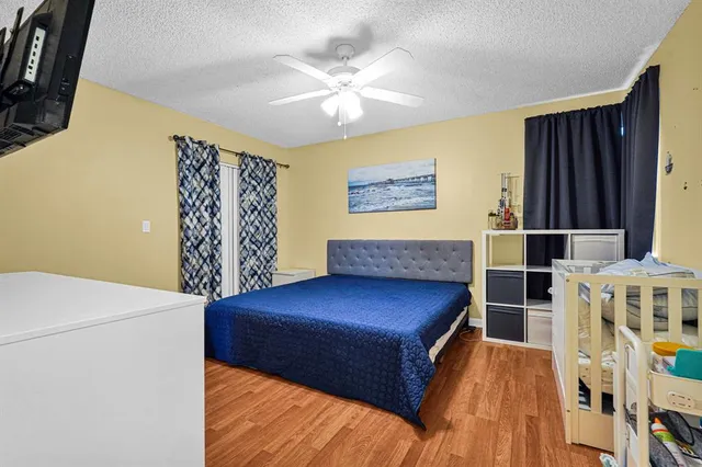 a bedroom with a bed and a bookshelf