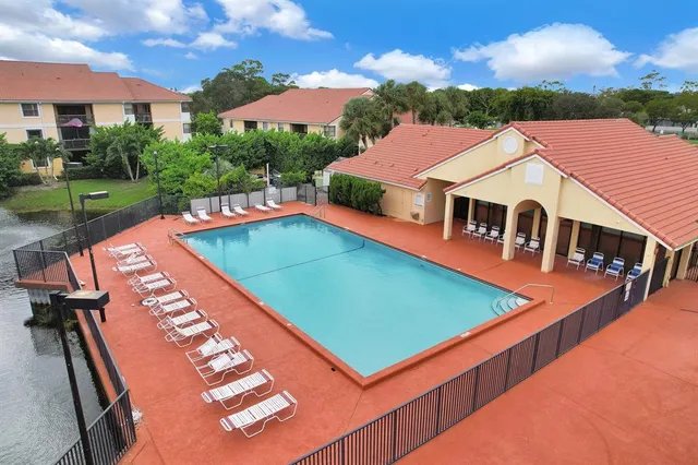 an aerial view of residential houses and outdoor space