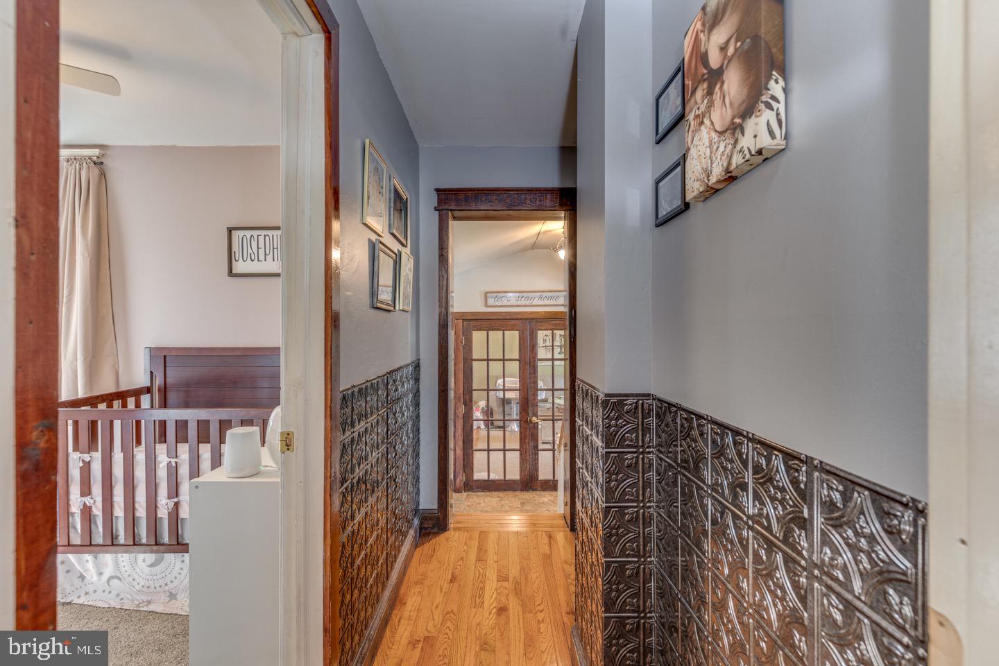 227 South Fellowship Road Maple Shade, NJ 08052 - Photo 17 of 41 a view of a hallway with wooden floor and stairs
