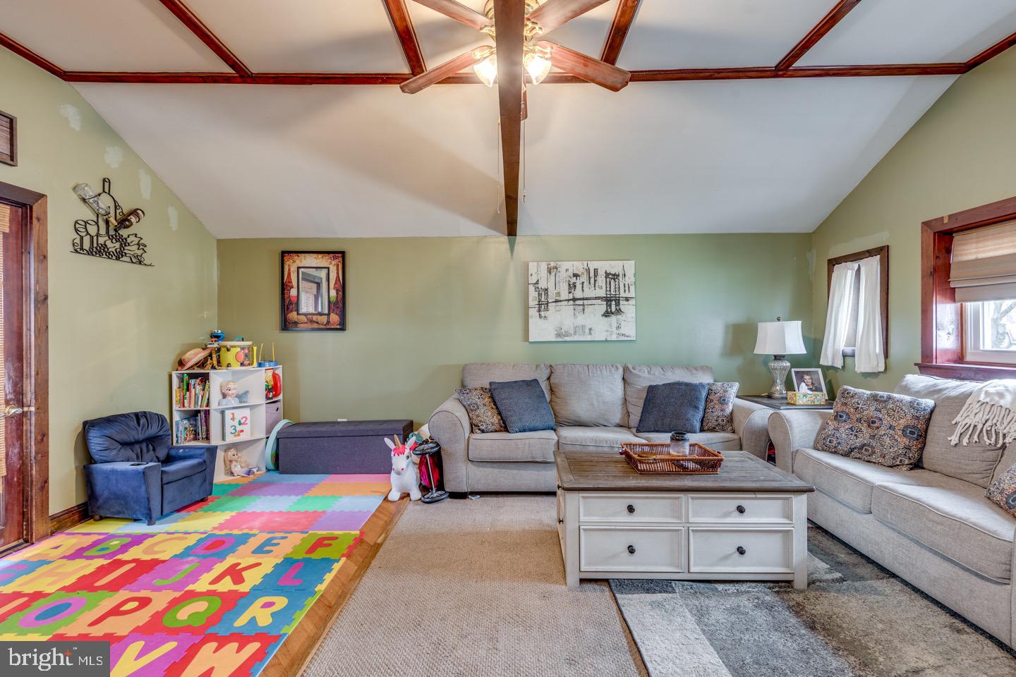 227 South Fellowship Road Maple Shade, NJ 08052 - Photo 18 of 41 a living room with furniture and a baby crib