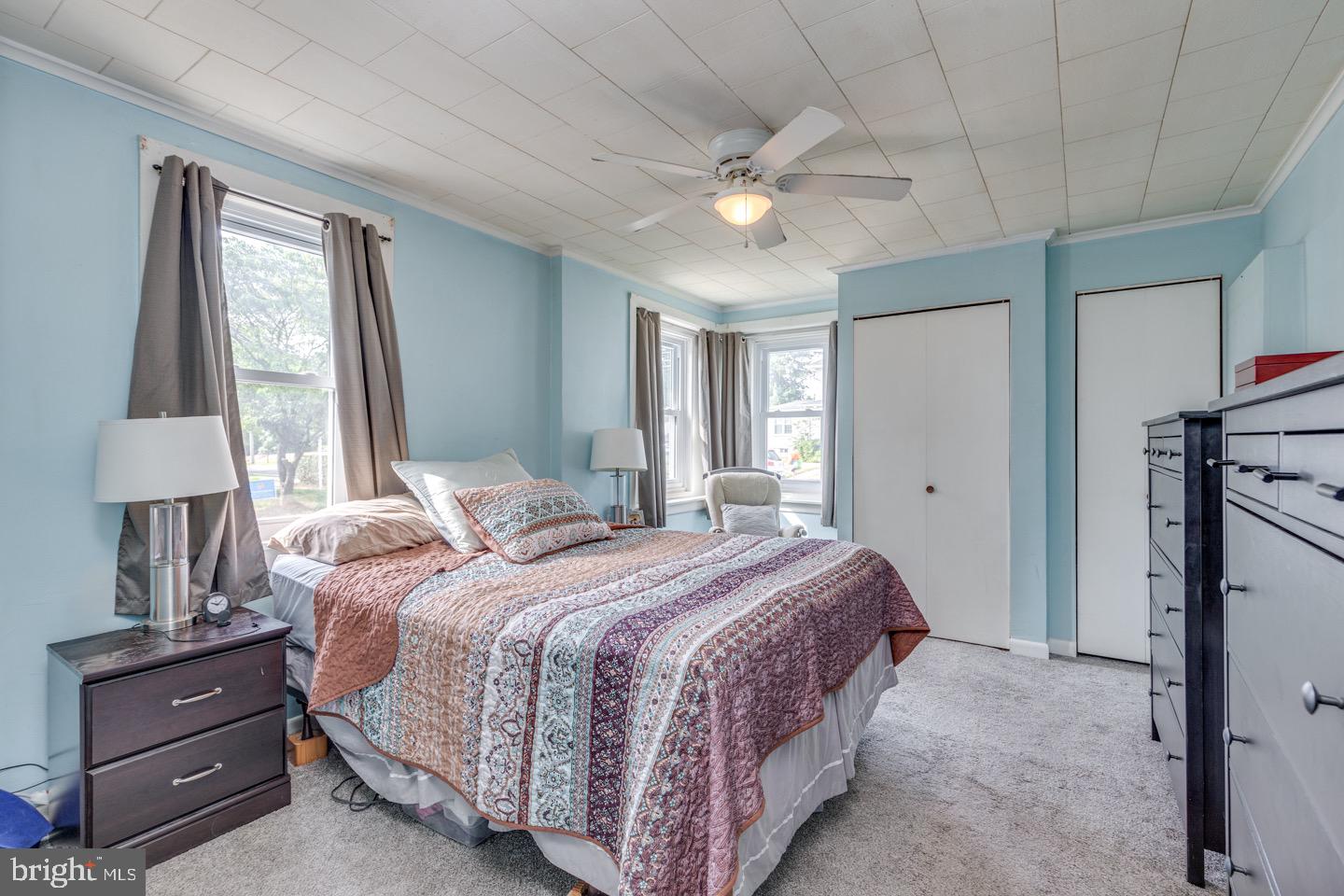 227 South Fellowship Road Maple Shade, NJ 08052 - Photo 24 of 41 a bedroom with a bed and a chandelier