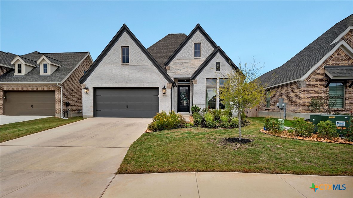 1816 Field Brook Seguin, TX 78155 - Photo 1 of 32 a front view of a house with a yard and garage