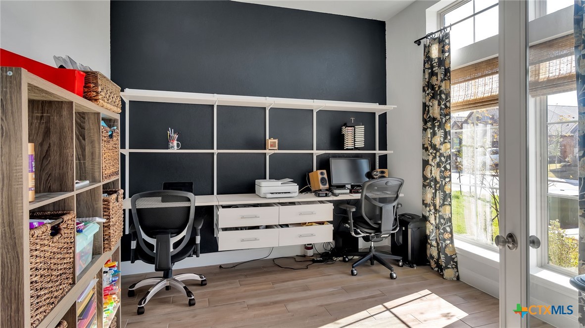 1816 Field Brook Seguin, TX 78155 - Photo 19 of 32 a view of a workspace with furniture and a window