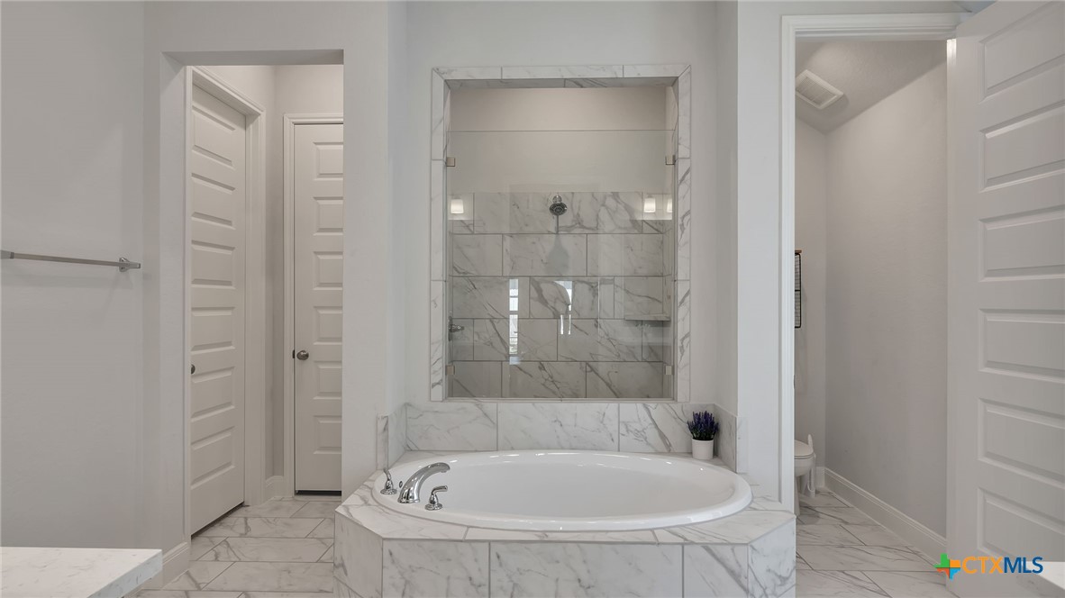 1816 Field Brook Seguin, TX 78155 - Photo 24 of 32 a bathroom with a bathtub and shower