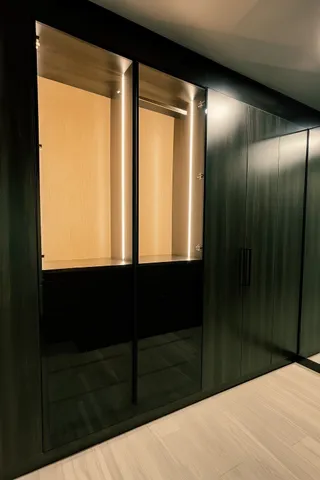 a bathroom with a tub sink mirror and vanity