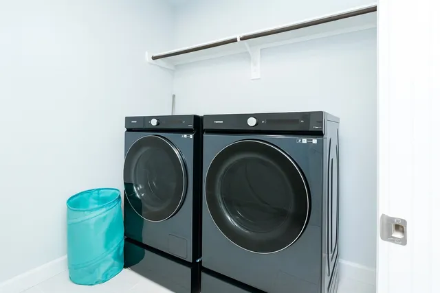 a view of a livingroom with a ceiling fan and window
