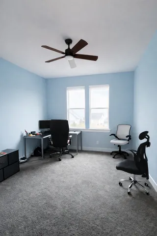 a spacious bathroom with a sink toilet and shower