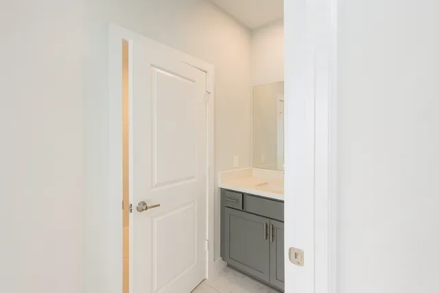 a bathroom with a mirror and a shower