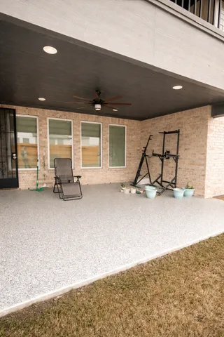 a backyard of a house with lots of green space and outdoor seating