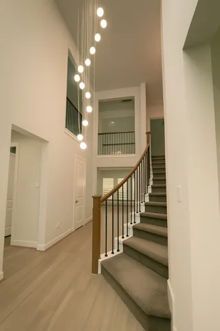 a view of entryway and hall with wooden floor