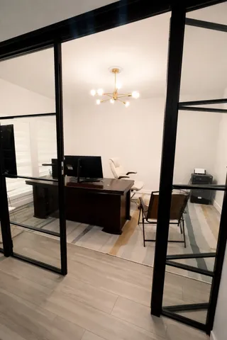 a view of living room with furniture and floor to ceiling window