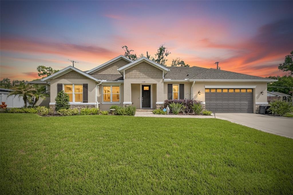 1008 West River Drive Temple Terrace, FL 33617 - Photo 1 of 1 a front view of a house with a garden