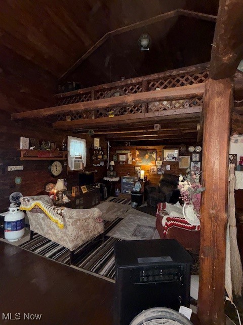 15639 Grove Road Southwest Port Washington, OH 43837 - Photo 22 of 31 Living room featuring vaulted ceiling and wooden walls