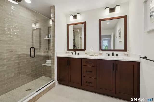 a bedroom with a bed and a night stand