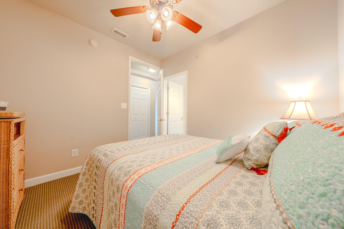 1217 Graves Harbor Trail, Unit 144 Huddleston, VA 24104 - Photo 12 of 30 a bedroom with a bed and a chandelier