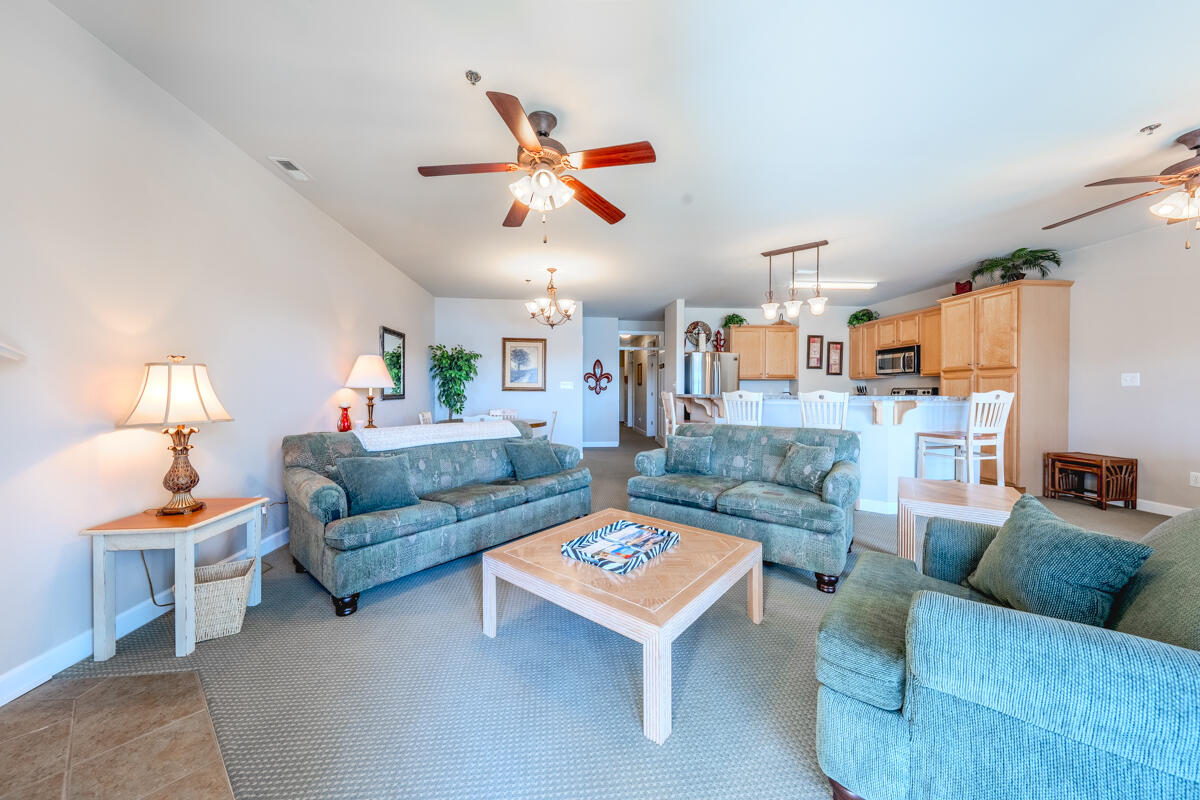 1217 Graves Harbor Trail, Unit 144 Huddleston, VA 24104 - Photo 18 of 30 a living room with furniture and a chandelier