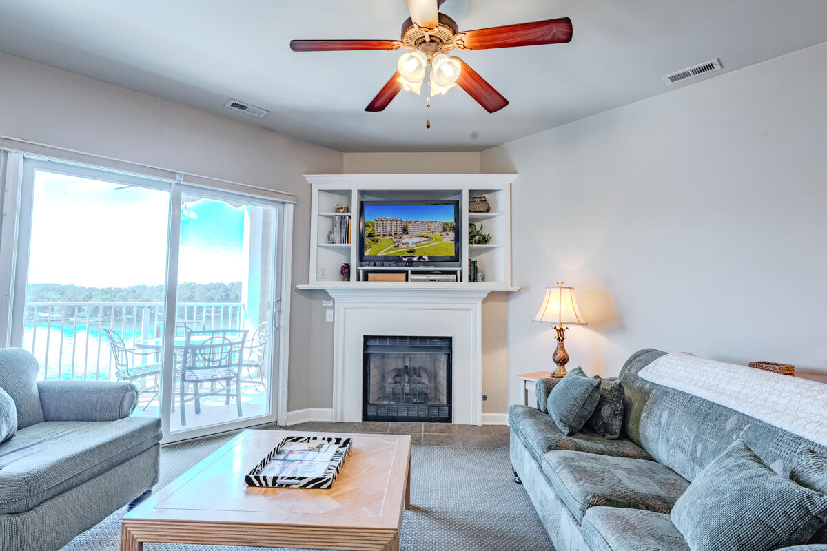 1217 Graves Harbor Trail, Unit 144 Huddleston, VA 24104 - Photo 19 of 30 a living room with furniture and a fireplace