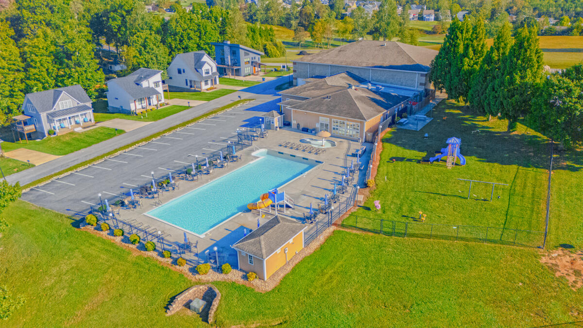 1217 Graves Harbor Trail, Unit 144 Huddleston, VA 24104 - Photo 26 of 30 an aerial view of a tennis ground and large trees