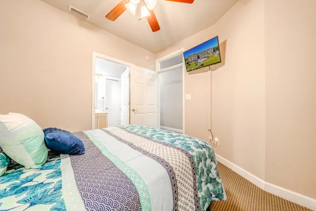 a bedroom with a bed and a dresser