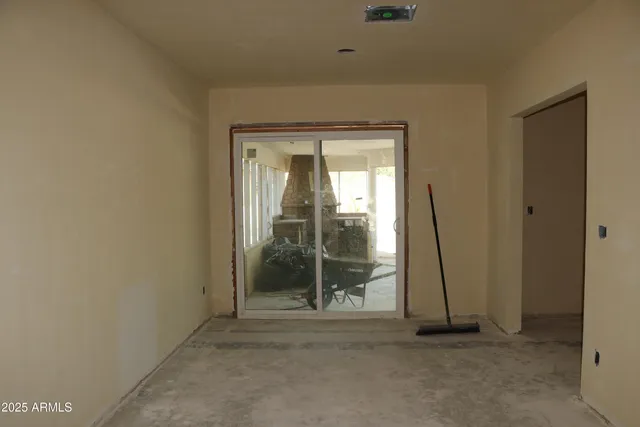 a view of a room with wooden door