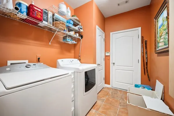 a utility room with dryer and washer