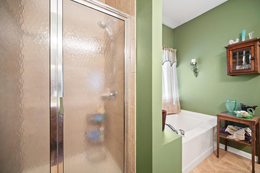 348 Mountain Laurel Walk Canton, GA 30114 - Photo 17 of 26 a bathroom with a shower and a sink