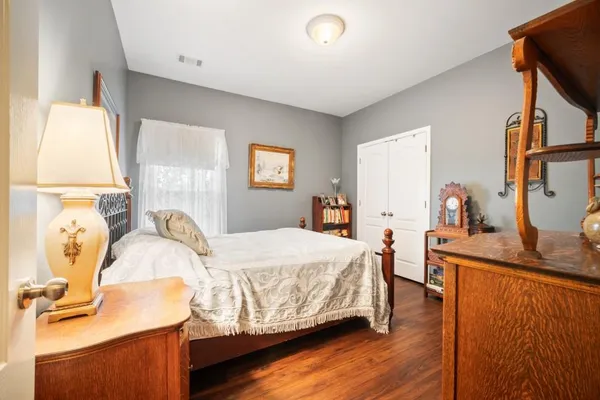 a bedroom with a bed and a table