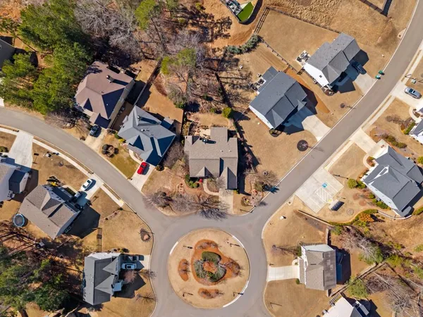 an aerial view of residential house with outdoor space and parking