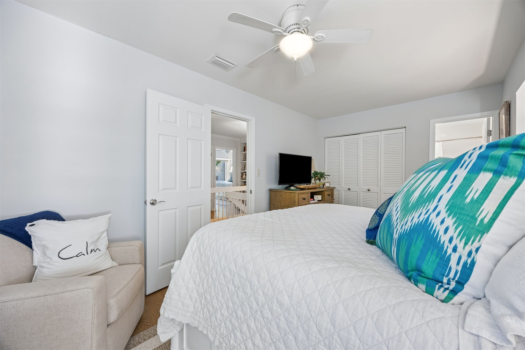 2005 Beachwood Road, Unit 2005 Amelia Island, FL 32034 - Photo 24 of 43 a bedroom with a bed and a flat screen tv